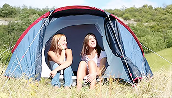 Two teens get dirty while camping